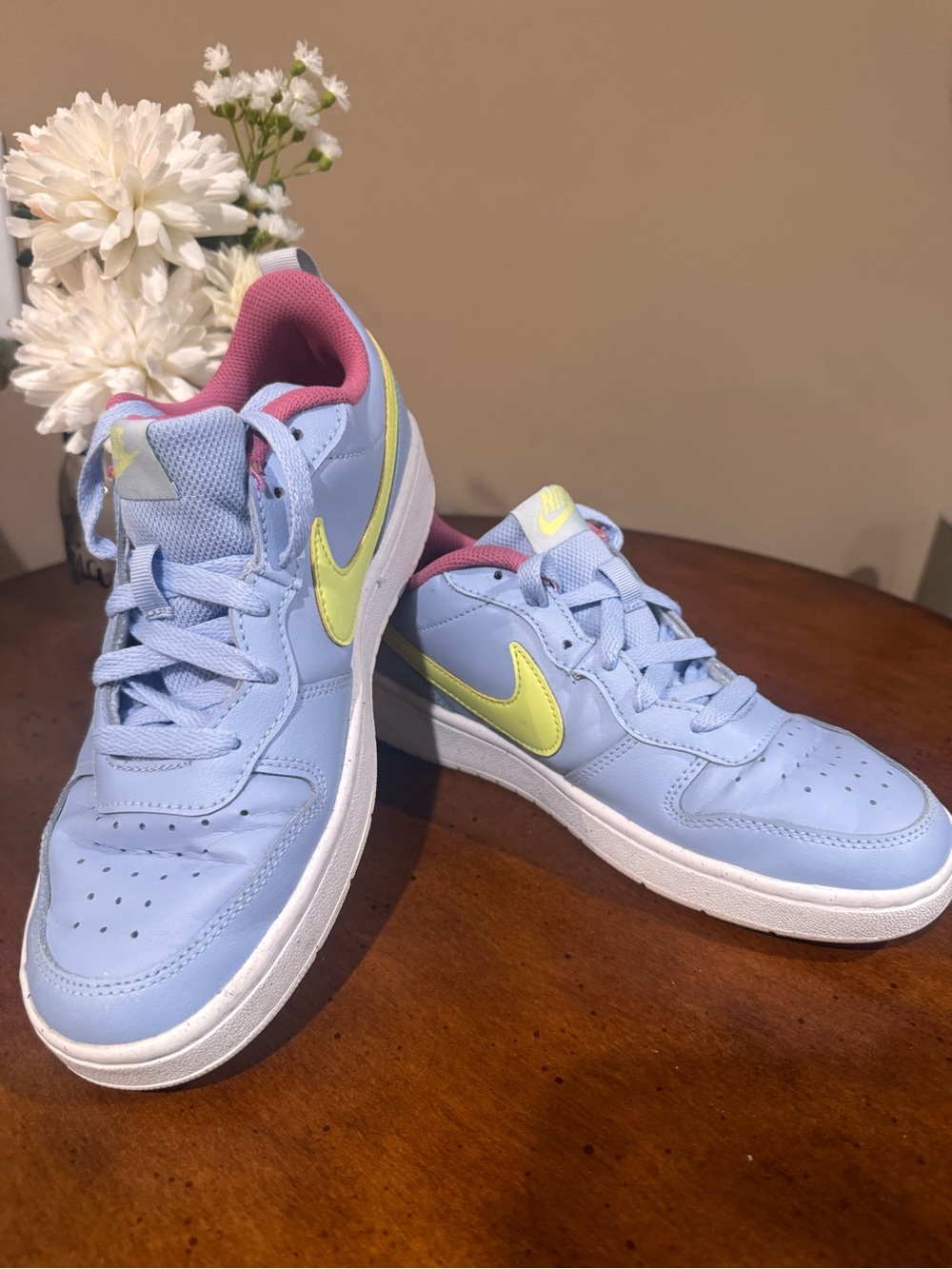 Nike Low-Top Sneakers in Light Blue with Yellow Swoosh and Pink Lining